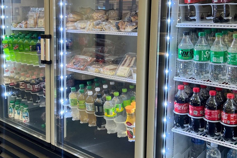 Hoshizaki glass door merchandiser refrigerators keeping beverages, snacks, and perishables fresh with bright interior LED lighting.