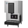 A stainless steel Hoshizaki water boiler and dispenser with two digital buttons and a drip tray at the bottom.