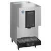 A stainless steel Hoshizaki commercial ice dispenser with a black front panel and drip tray, standing on four legs.