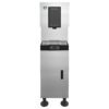 A stainless steel commercial ice and water dispenser with a front panel, spout, drip tray, and control buttons, standing on four legs.