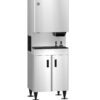 A commercial stainless steel ice and water dispenser with a storage cabinet and two dispensing spouts, standing on four black legs.