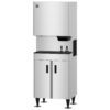 Commercial stainless steel ice machine with upper dispenser unit and lower storage cabinet, standing on adjustable legs.