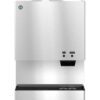 A stainless steel countertop ice and water dispenser with two buttons labeled "Ice" and "Water" and a dispensing area below.
