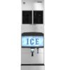 Commercial stainless steel ice dispenser machine with a front panel displaying the word "ICE" in blue letters, and a lever for dispensing ice below.