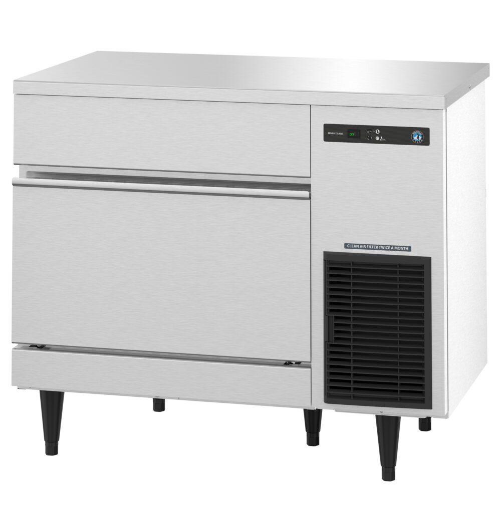 Stainless steel commercial undercounter ice maker with digital display, vent, and two pull-out drawers, standing on four black legs.