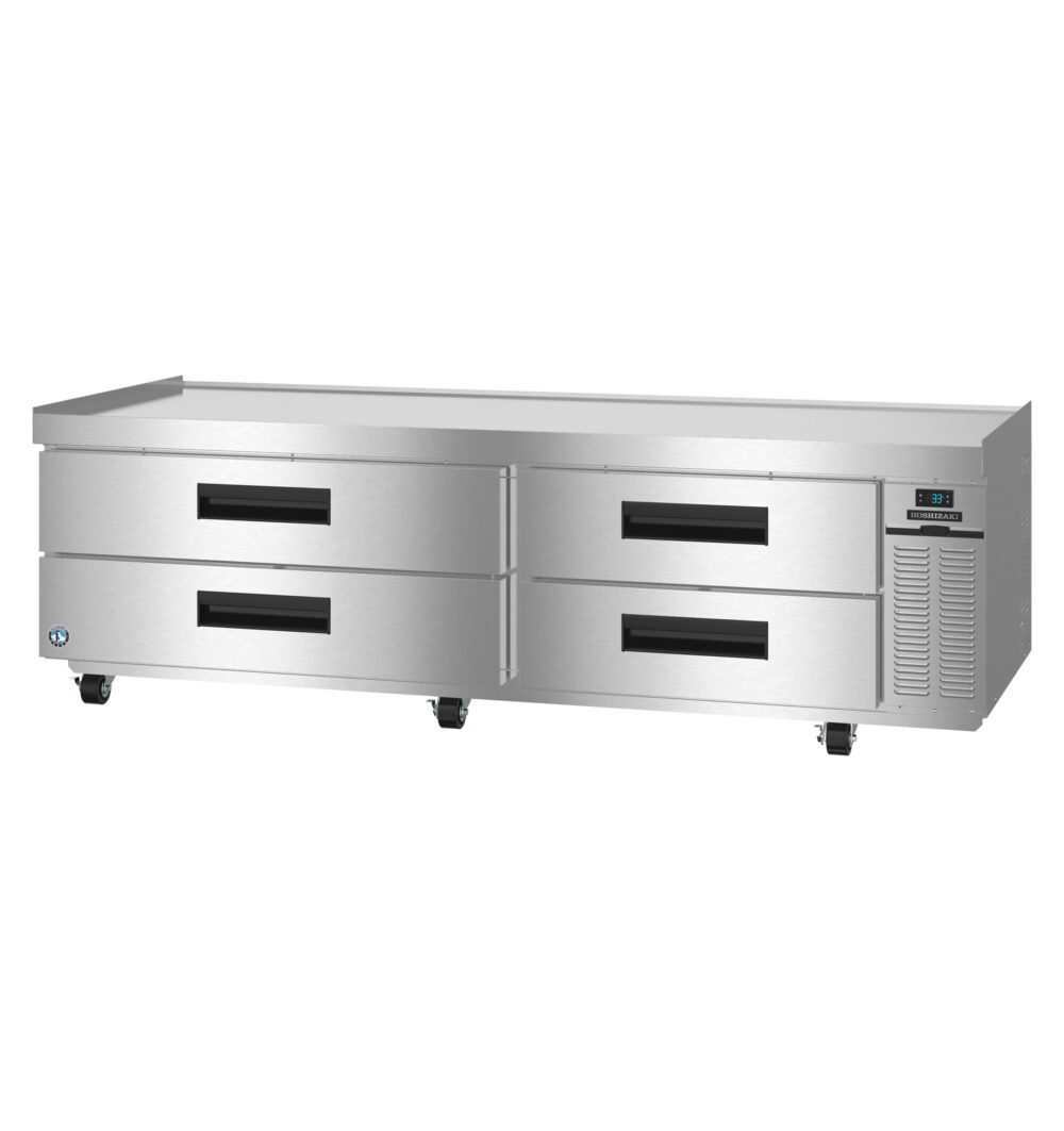 Stainless steel commercial refrigerated chef base with four pull-out drawers, black handles, and digital temperature display on the right side, set on wheels.
