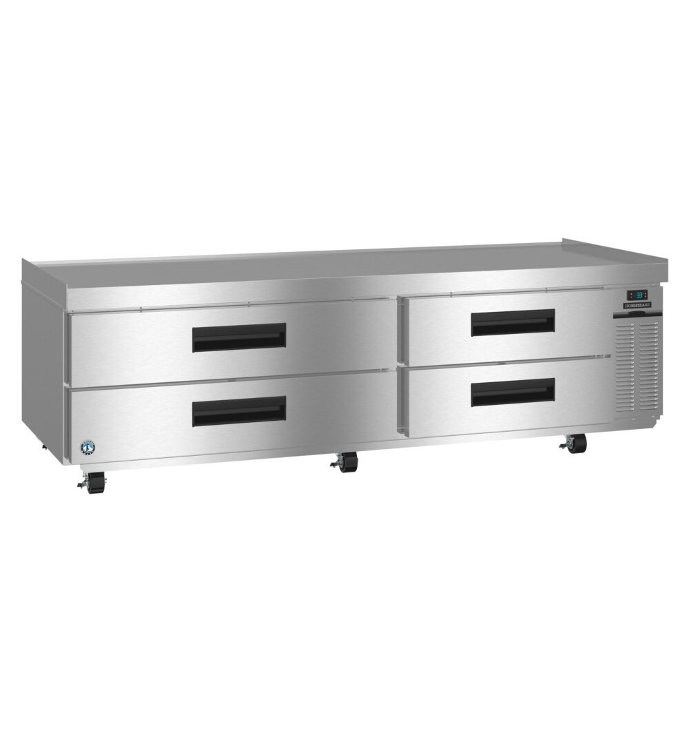 A stainless steel commercial refrigerator with four pull-out drawers, digital temperature display, and caster wheels.