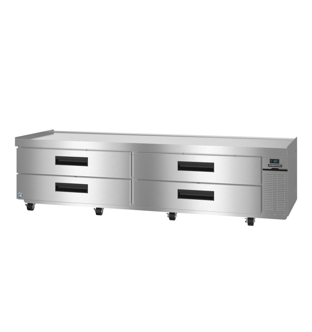 Stainless steel commercial refrigerator with four pull-out drawers, digital control panel, and ventilation on the right side, set on caster wheels.
