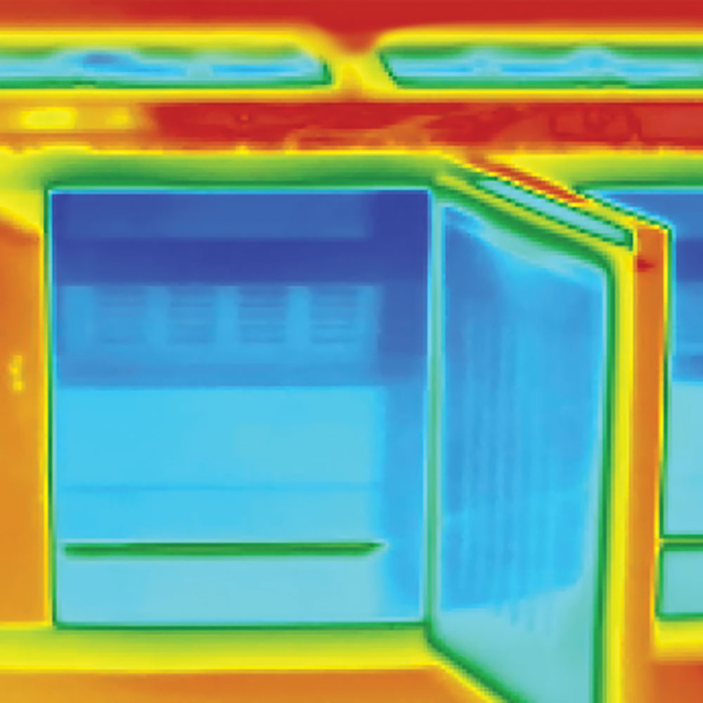 Thermal image showing an open refrigerator door; cold areas appear blue, while warmer surroundings are yellow, orange, and red.