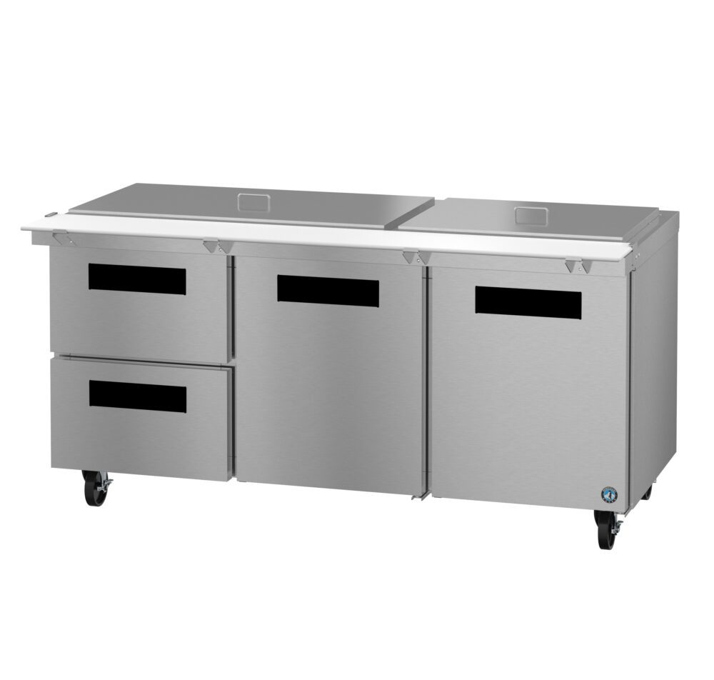 A commercial stainless steel prep table with two drawers and two doors, equipped with a flat top and caster wheels.