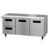 A commercial stainless steel prep table with two drawers and two doors, equipped with a flat top and caster wheels.