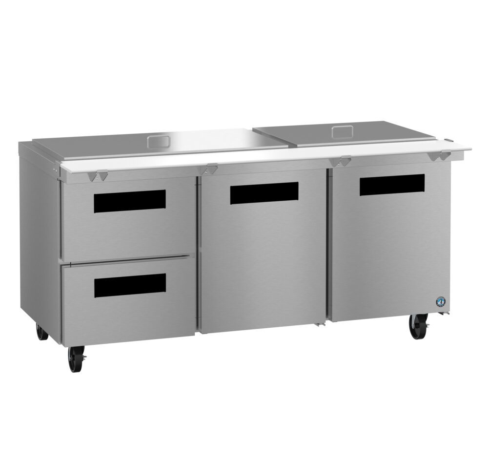 Stainless steel commercial kitchen refrigerator with two drawers, two doors, a flat top surface, and wheels for mobility.