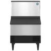 Commercial stainless steel ice maker with a black base and legs, viewed from the front against a white background.