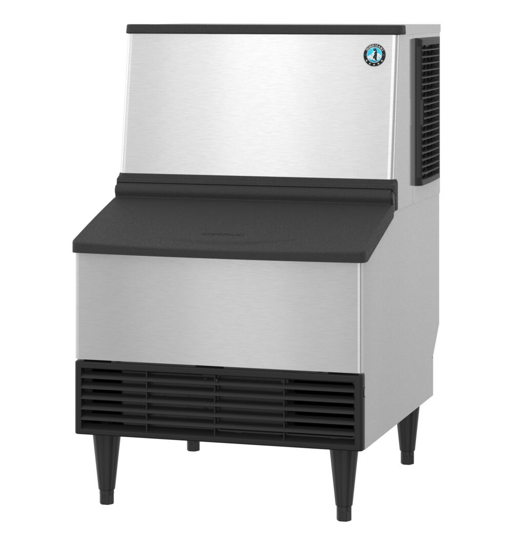 A commercial stainless steel ice maker with black accents, standing on four legs, featuring a front vent and top-mounted ice dispenser.
