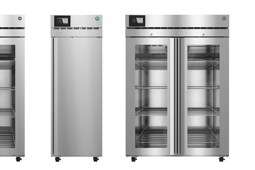 Three commercial stainless steel refrigerators are shown: one single-door, one double-door with glass windows, and one partially visible unit on the left.