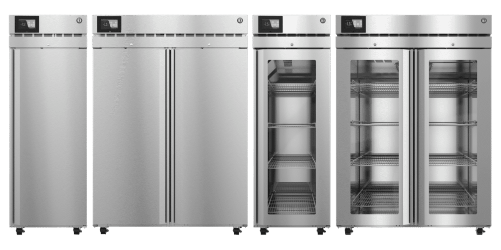 Four commercial stainless steel refrigerators stand side by side; two have solid doors, and two have glass doors showing empty wire shelves inside.