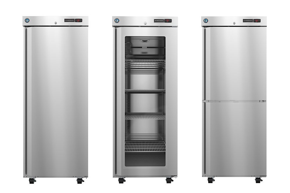 Three stainless steel commercial refrigerators are shown side by side; the middle unit's door is open, revealing multiple wire shelves inside.