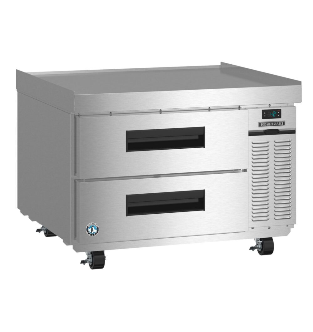 A stainless steel commercial refrigerator with two pull-out drawers, control panel, ventilation slots, and casters for mobility.