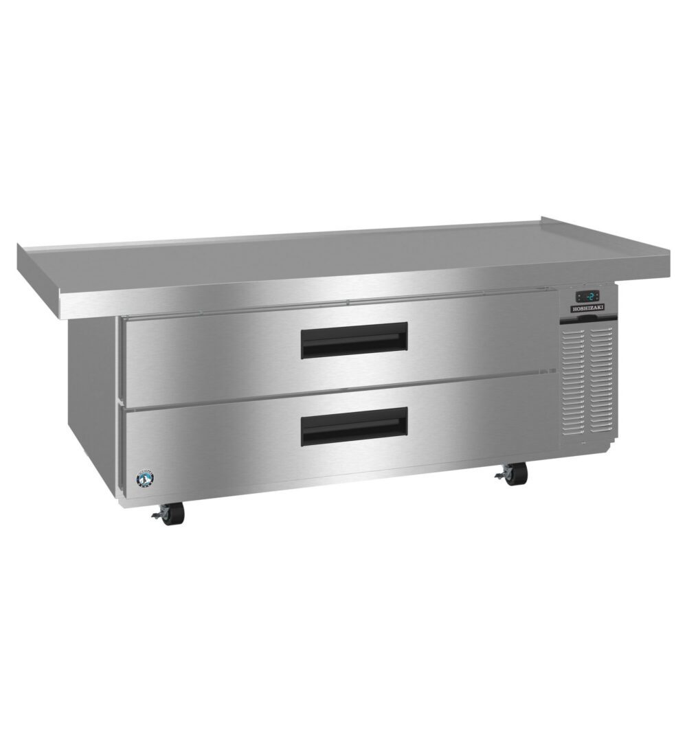 Stainless steel commercial refrigeration unit with two pull-out drawers, a flat worktop surface, and caster wheels.