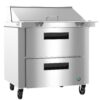 Stainless steel commercial kitchen prep table with two pull-out drawers, a top lid, and wheels for mobility.