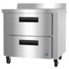 Stainless steel commercial refrigerator with two pull-out drawers on wheels, suitable for kitchen or food service use.
