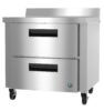 Stainless steel commercial refrigerator with two pull-out drawers on wheels, suitable for kitchen or food service use.