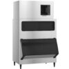 Large commercial stainless steel ice maker with a top cooling vent and a black front-access door on the storage bin, standing on four legs.