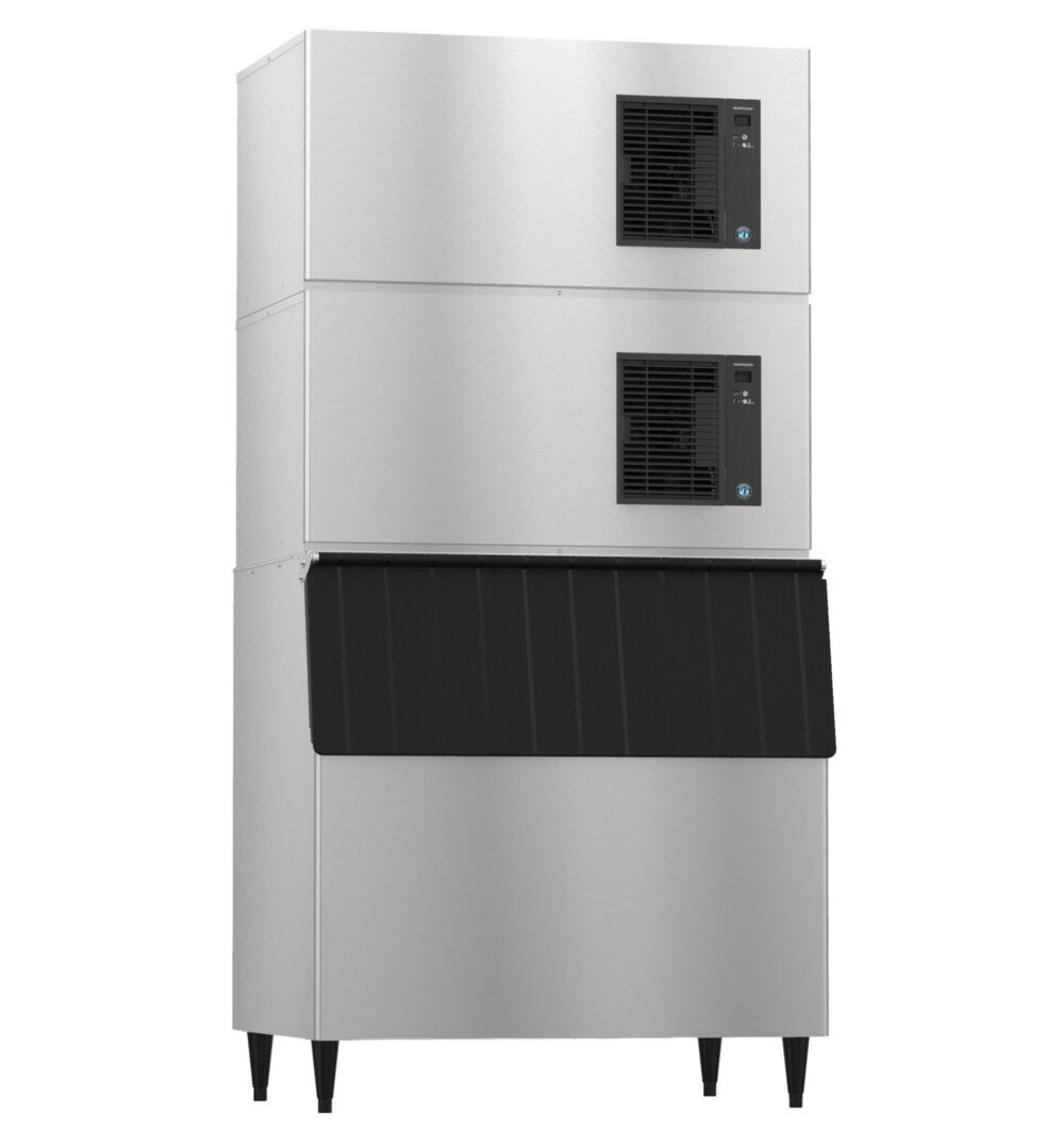 Commercial stainless steel ice machine with two stacked cooling units on top and a black ice storage bin at the bottom, standing on four legs.
