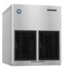 Stainless steel Hoshizaki ice machine with two black front vents and a label reading “Clean air filter twice a month.”.