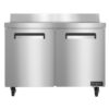 Stainless steel commercial refrigerator with two doors, on wheels, and a backsplash, viewed from the front.