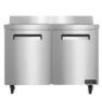 Stainless steel commercial refrigerator with two doors, on wheels, and a backsplash, viewed from the front.