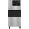 A commercial stainless steel ice maker machine with a black panel and vented section at the top, standing on four legs.