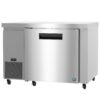 Stainless steel commercial undercounter refrigerator with a digital temperature display and caster wheels.