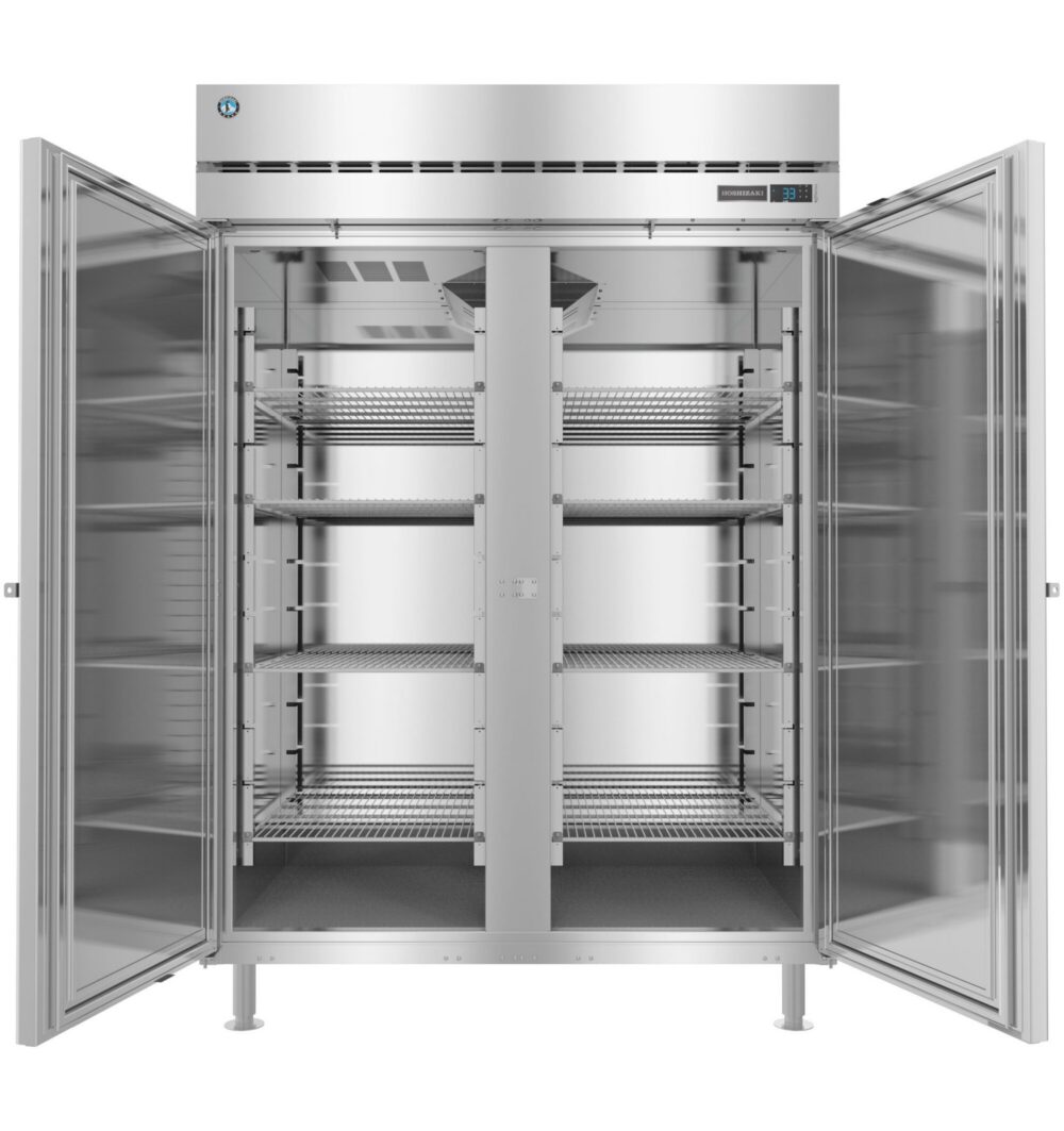 A large, industrial stainless steel refrigerator with both doors open, showing multiple empty wire shelves inside.